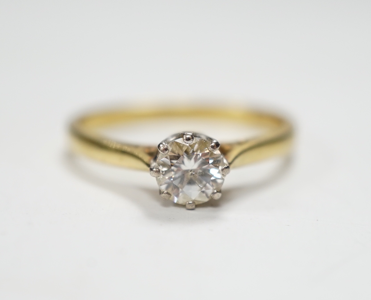 A modern 18ct gold and solitaire diamond ring, the stone measuring 5.2mm in diameter, size O/P, gross weight 2.9 grams.